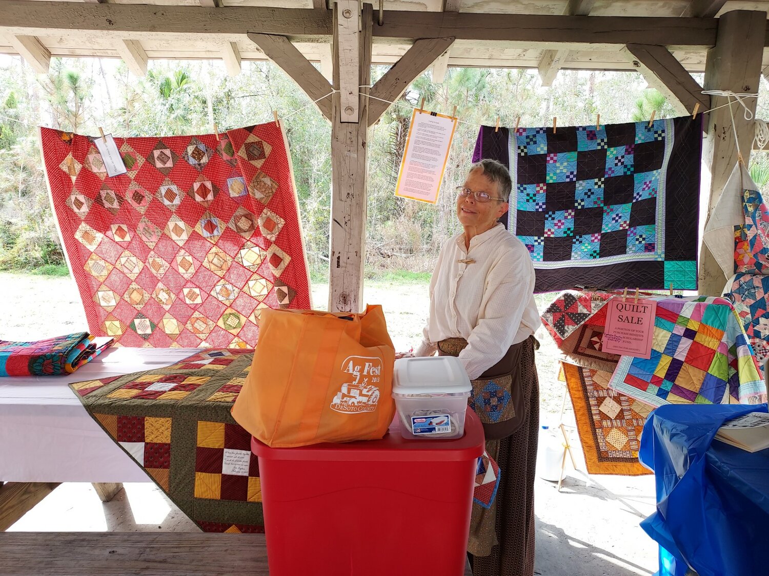 Karen Smoke with her colorful quilts at CCC Festival in February of 2023.